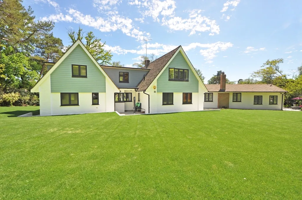 Wide, even green lawn in front of a two-story home